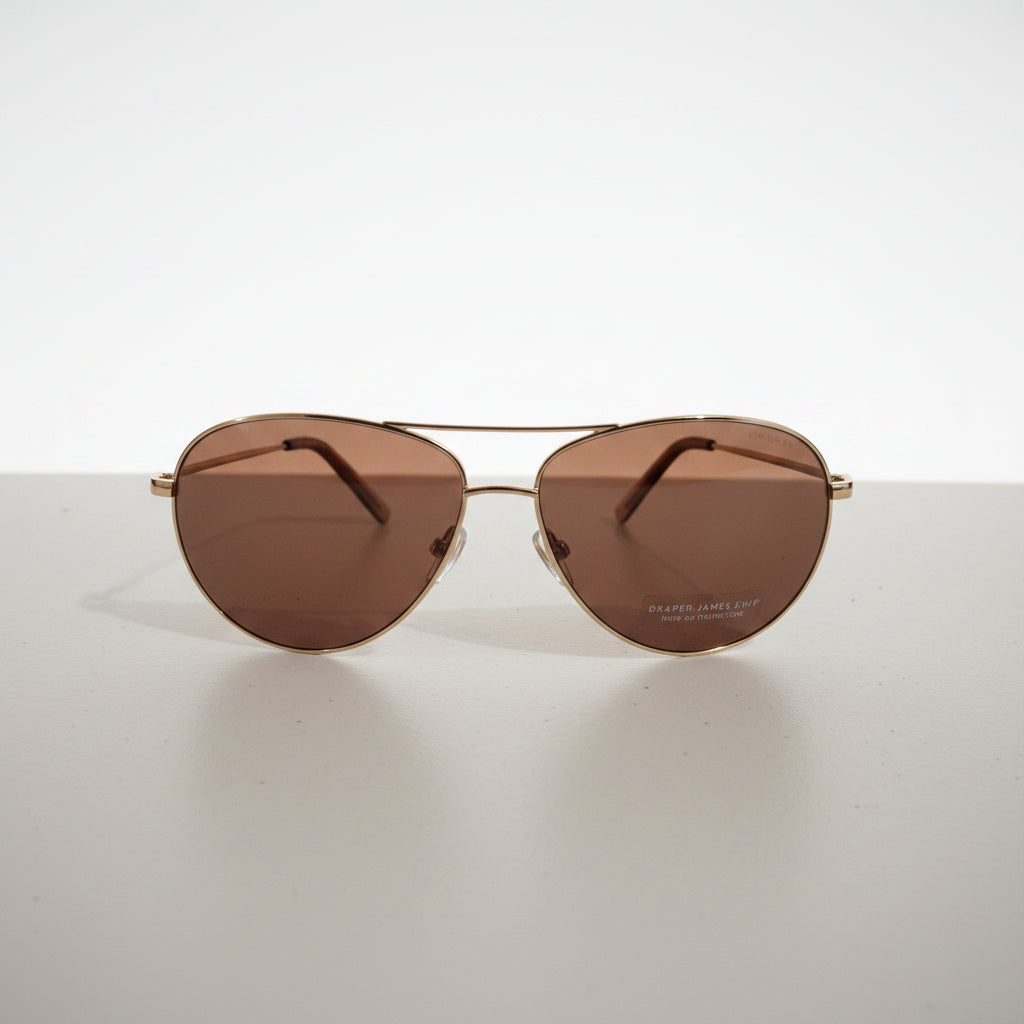 Draper James sunglasses classic aviator style with gold-toned metal frames.