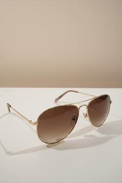 Draper James sunglasses classic aviator style with gold-toned metal frames.